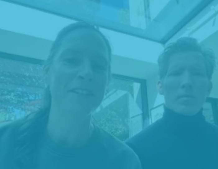 Helen and Michael indoors with large glazing behind them, overlaid in WindowTreat blue to mark their success story.