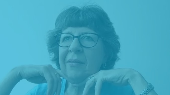 Sarah indoors with a calm expression, overlaid in WindowTreat blue to represent her success story after investing in a Twin Athena roof blind