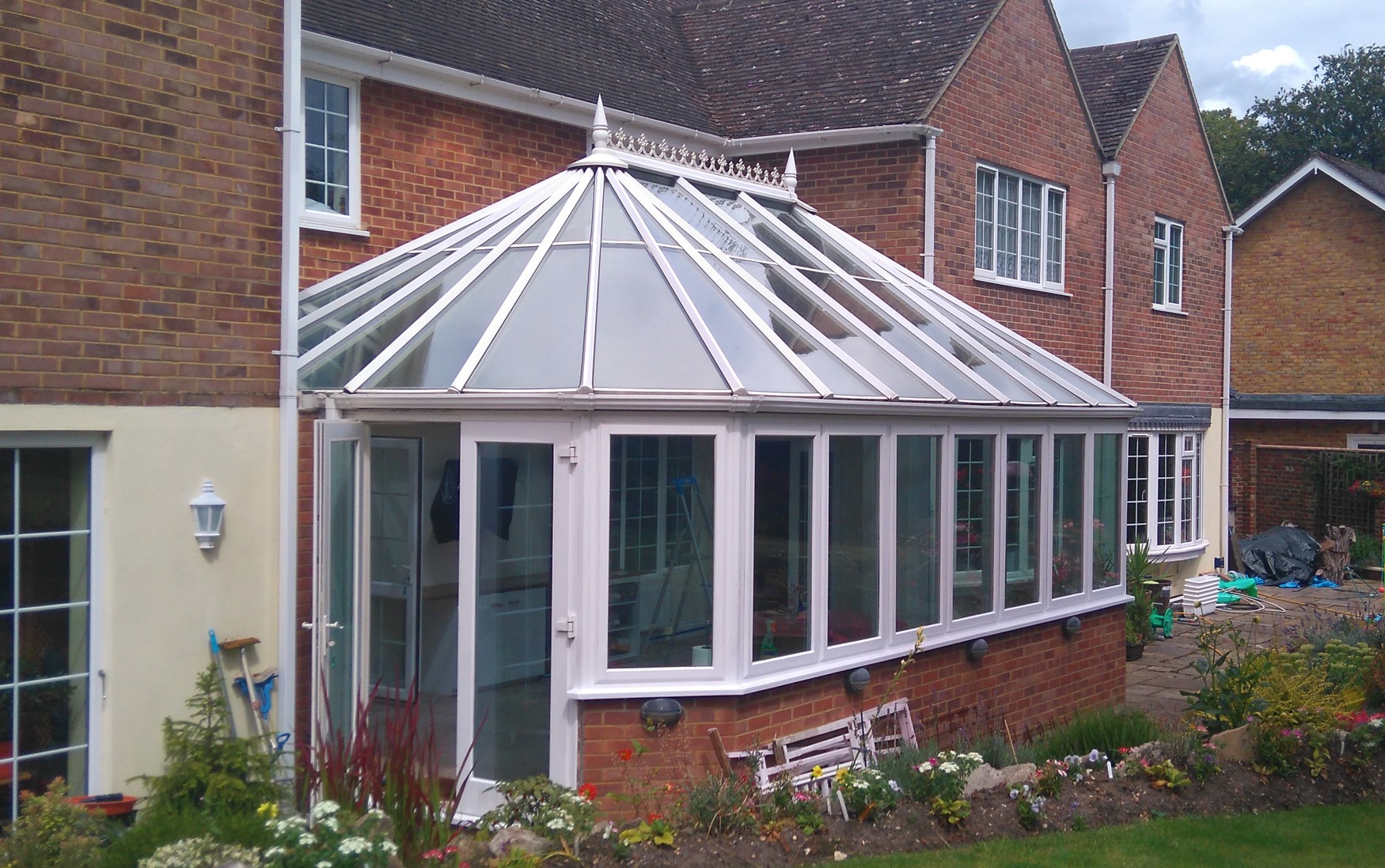onservatory with glass roof and large windows, treated with solar control window film.