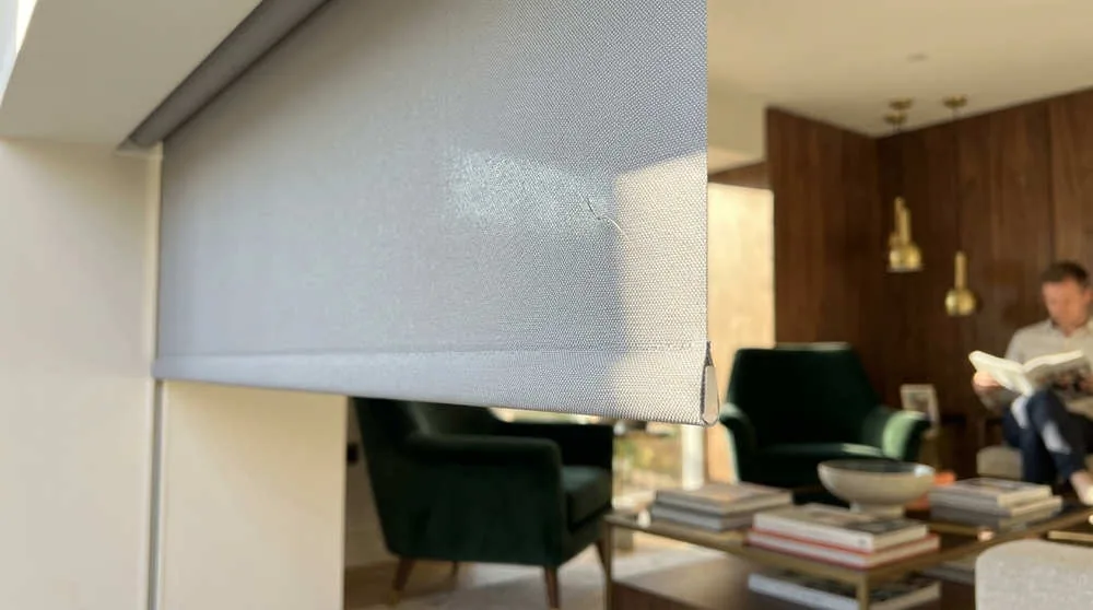 A close-up view of a high-performance fabric shows the technical weave designed to reflect solar heat, not just block light.