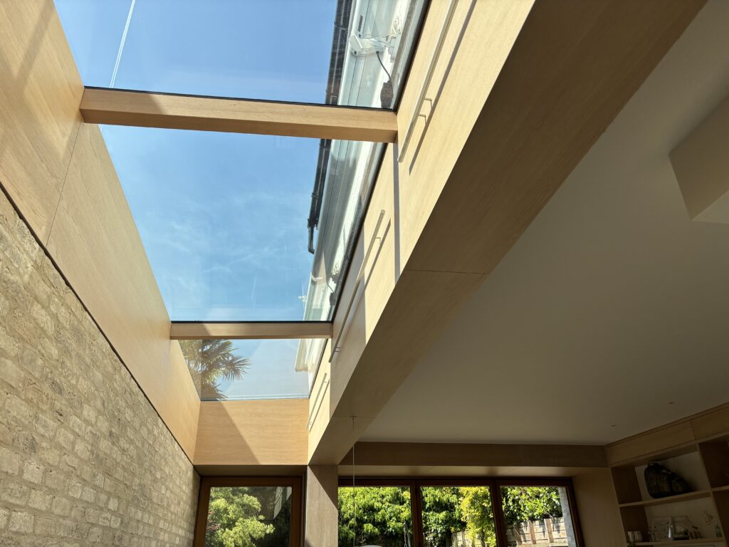 Upward view showing Janice’s cassette awnings mounted on the wall above the side return glazing.
