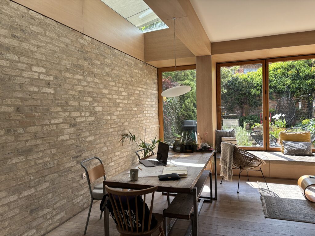 Extended cassette awnings providing shade above the side return glazing.